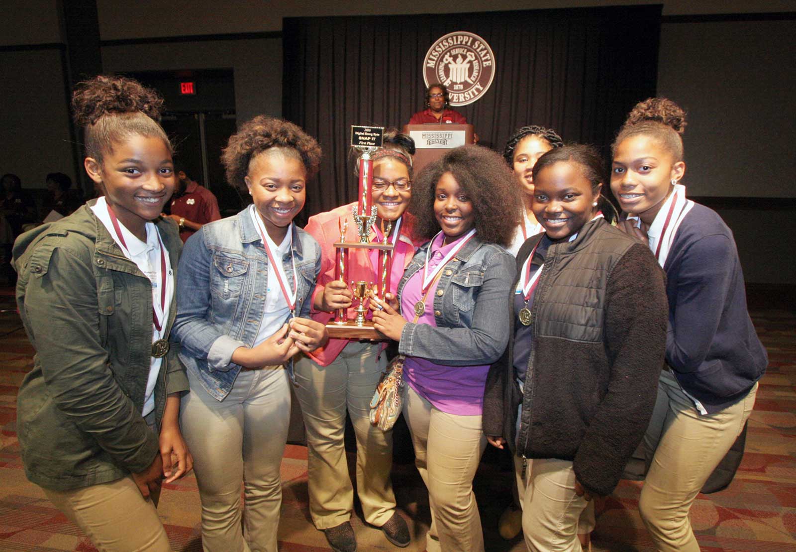 students with trophy