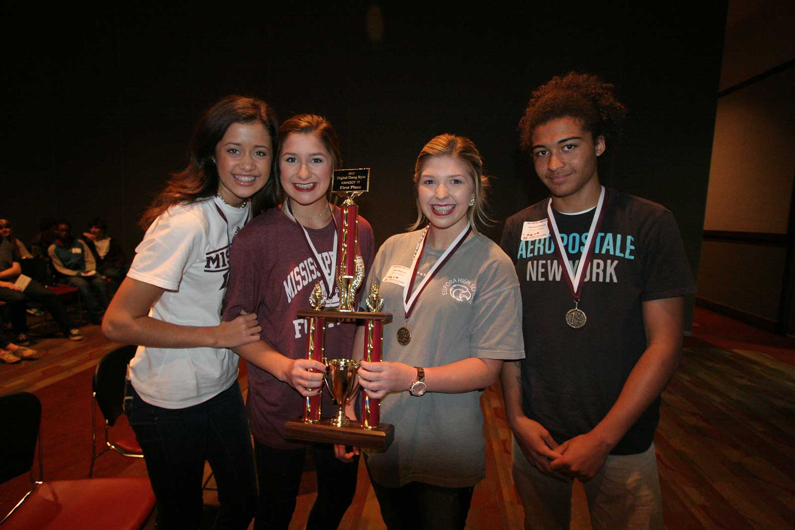 students with trophy